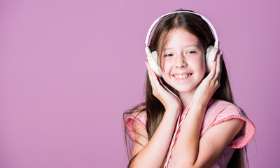Fototapeta premium Perfect sound. Having fun. Listen for free. Enjoy music concept. Music app. Audio book. Educative content. Study english language with audio lessons. Girl listen music modern headphones gadget