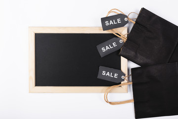 Top view blackboard with shopping bags