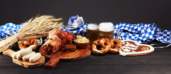 Traditional German cuisine, Schweinshaxe roasted ham hock. Beer, pretzels and various Bavarian...