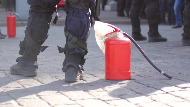 Police with fire extinguisher to disperse rallies