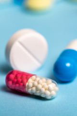 Studio shot of medical pills on blue background