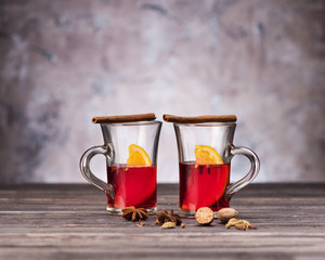 Christmas Mulled wine with spices on wooden background