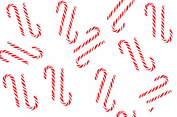Christmas candy cane pattern on blue white background. Flat lay and top view