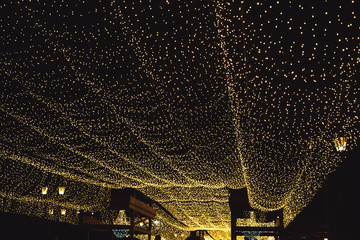 Abstract bokeh from Lighting decor for background. Night festive lighting of a city street
