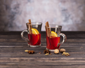 Christmas Mulled wine with spices on wooden background