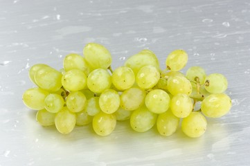 Bunch of Washed Green Grapes on Metal Plate