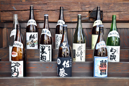 TOKYO, JAPAN Collection of sake bottles in the window display of restaurant