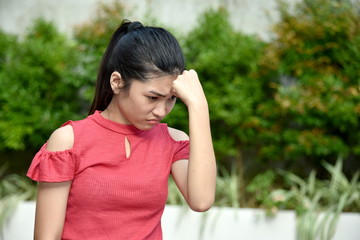 Naklejka premium A Sad Young Asian Person