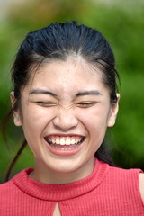 An A Teenage Female Laughing