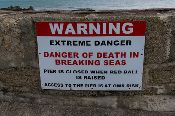 Harbour arm warning sign, Porthleven, Cornwall