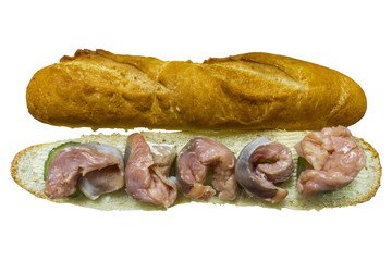 Fish sandwich.Five slices of salted pink salmon, two halves of baguette, pickle and butter. Close up.  Top view. Site about kitchen and cooking.