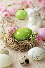 Fototapeta na wymiar easter eggs and flowers, seasonal table decoration