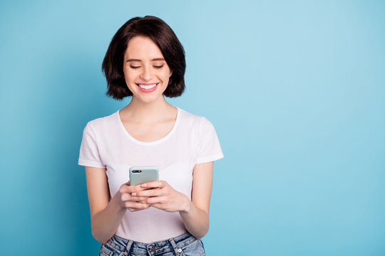 Portrait of her she nice attractive lovely cheerful focused girl using wireless connection internet online fast speed web service isolated on bright vivid shine vibrant blue turquoise color background - Powered by Adobe