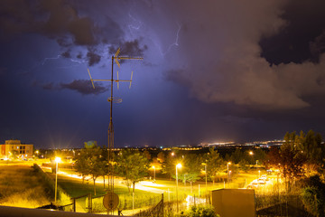 Storm at night in Zaragoza lights