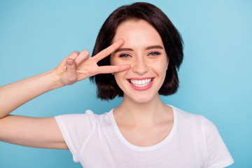Close-up portrait of her she nice attractive lovely cheerful cheery positive girl showing v-sign...
