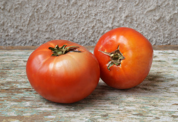 organic tomatoes on wooden background