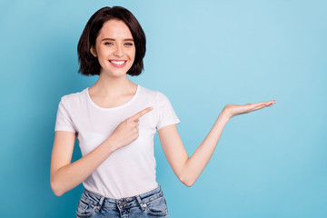 Portrait of her she nice attractive lovely cheerful cheery glad confident girl pointing holding...