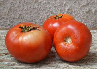 organic tomatoes on wooden background