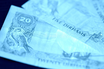 United Arab Emirates banknotes close up blue color toned