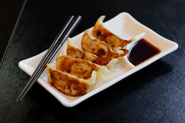 Japanese gyoza or dumplings snack with soy sauce