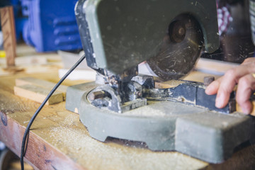 Detail of a miter machine working in a carpentry shop