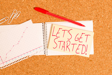 Word writing text Let S Get Started. Business photo showcasing encouraging someone to begin doing something Desk notebook paper office cardboard paperboard study supplies table chart