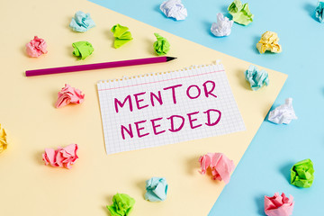 Text sign showing Mentor Needed. Business photo text wanted help for more experienced or more knowledgeable demonstrating Colored crumpled papers empty reminder blue yellow background clothespin