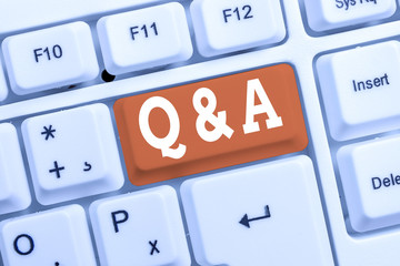 Handwriting text Q And A Question. Conceptual photo in which demonstrating asks questions and another one answers them White pc keyboard with empty note paper above white background key copy space