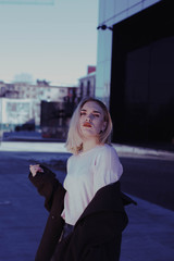 Fototapeta premium portrait of a blonde girl in a coat