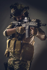 Fototapeta na wymiar Special soldier military studio shooting.