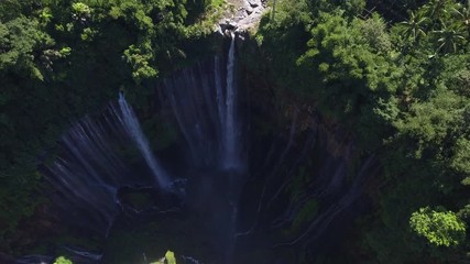 Aerial : Fly cam open view to Tumpak Sewu waterfall , Java island, Indonesia