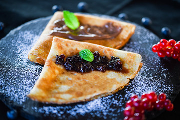 delicious home made pancakes with fresh fruits & chocolate