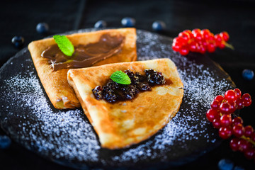 delicious home made pancakes with fresh fruits & chocolate