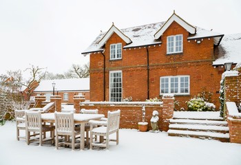 House and patio in snow