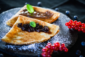 delicious home made pancakes with fresh fruits & chocolate