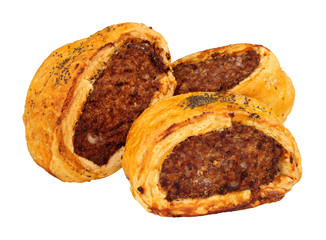 Pork and black pudding savoury sausage rolls isolated on a white background