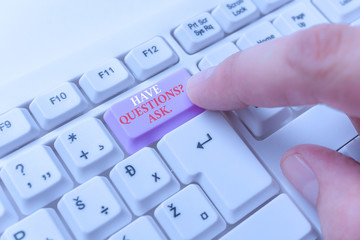 Conceptual hand writing showing Have Questionsquestion Ask. Concept meaning something that you say or write to ask a demonstrating White pc keyboard with note paper above the white background