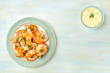 Fried shrimps with a dip, seafood banner design template, shot from the top with copy space