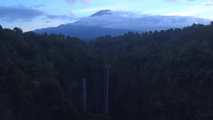 Aerial: Fly cam open view to  Semeru volcano and Tumpak Sewu waterfall , Java island, Indonesia