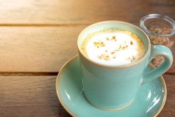 Hot coffee latte  and rock sugar brown on wood table.