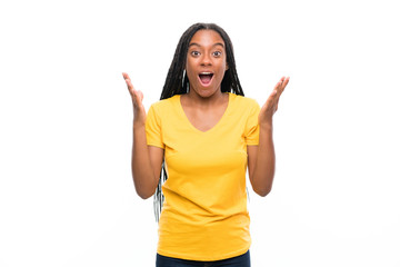 African American teenager girl with long braided hair over isolated white background with surprise facial expression