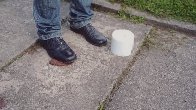 Accidentally stepping into shit on the pavement but fortunately there is a toilet paper roll nearby. Lucky guy, best day!