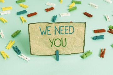 Handwriting text writing We Need You. Conceptual photo to fulfill the needs of the assignment duty or obligation Colored clothespin papers empty reminder blue floor background office pin