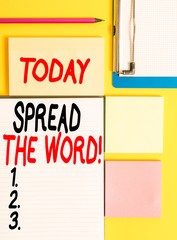 Conceptual hand writing showing Spread The Word. Concept meaning share the information or news using social media Empty papers with copy space on yellow background table