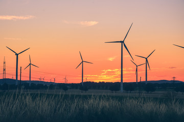 Sunset with windmill, wind turbine, wind generator