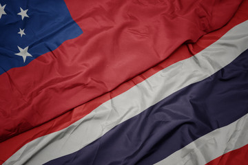 waving colorful flag of thailand and national flag of Samoa .