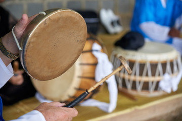 A person who plays samulnori, a traditional Korean music