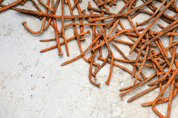 Fototapeta premium Rusty nails on a cement metal background