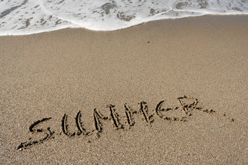 Fototapeta na wymiar Summer, word written on the beach