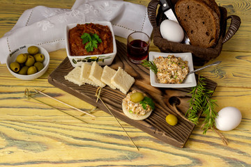 Varied, fresh, tasty snacks and aperitif on wooden table close-up